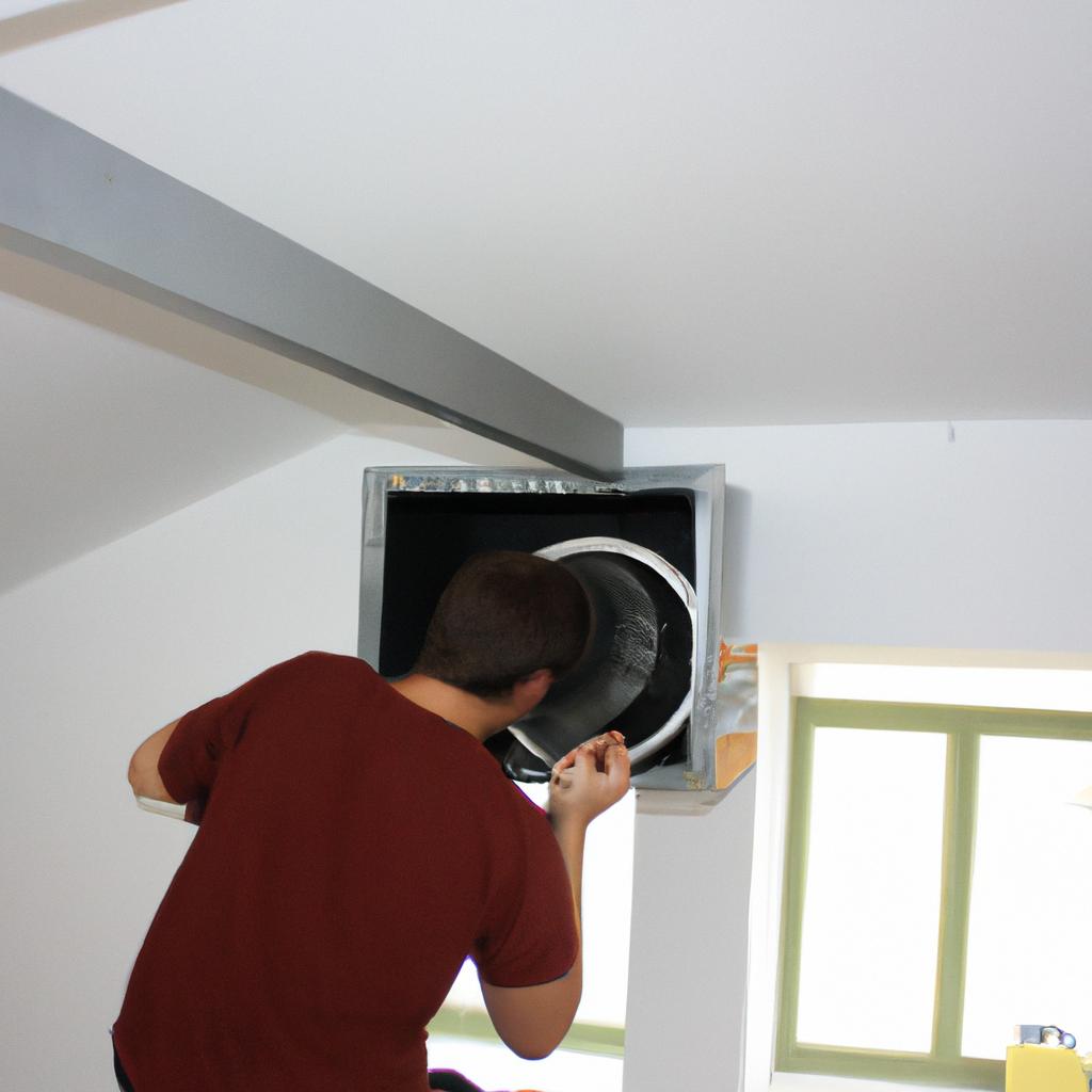 Person installing ventilation in kitchen