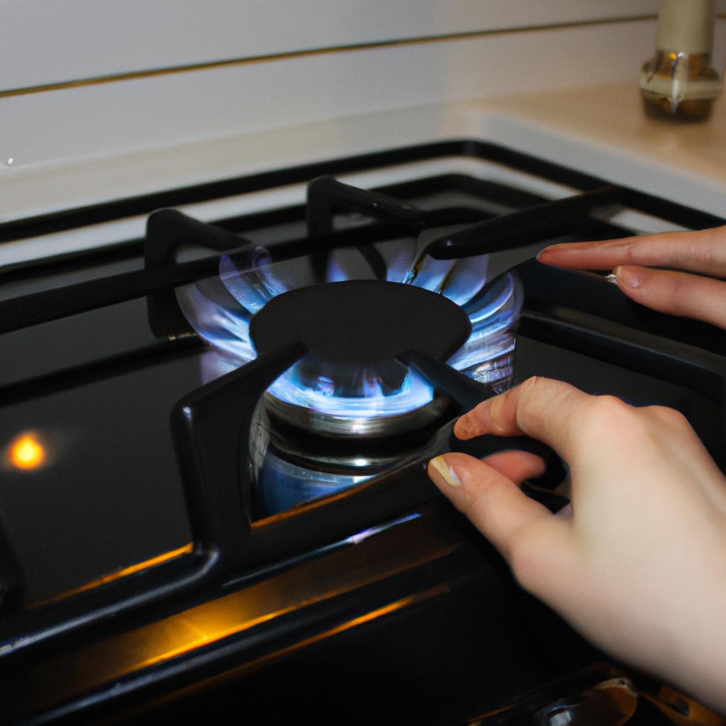 Woman adjusting gas stove flame